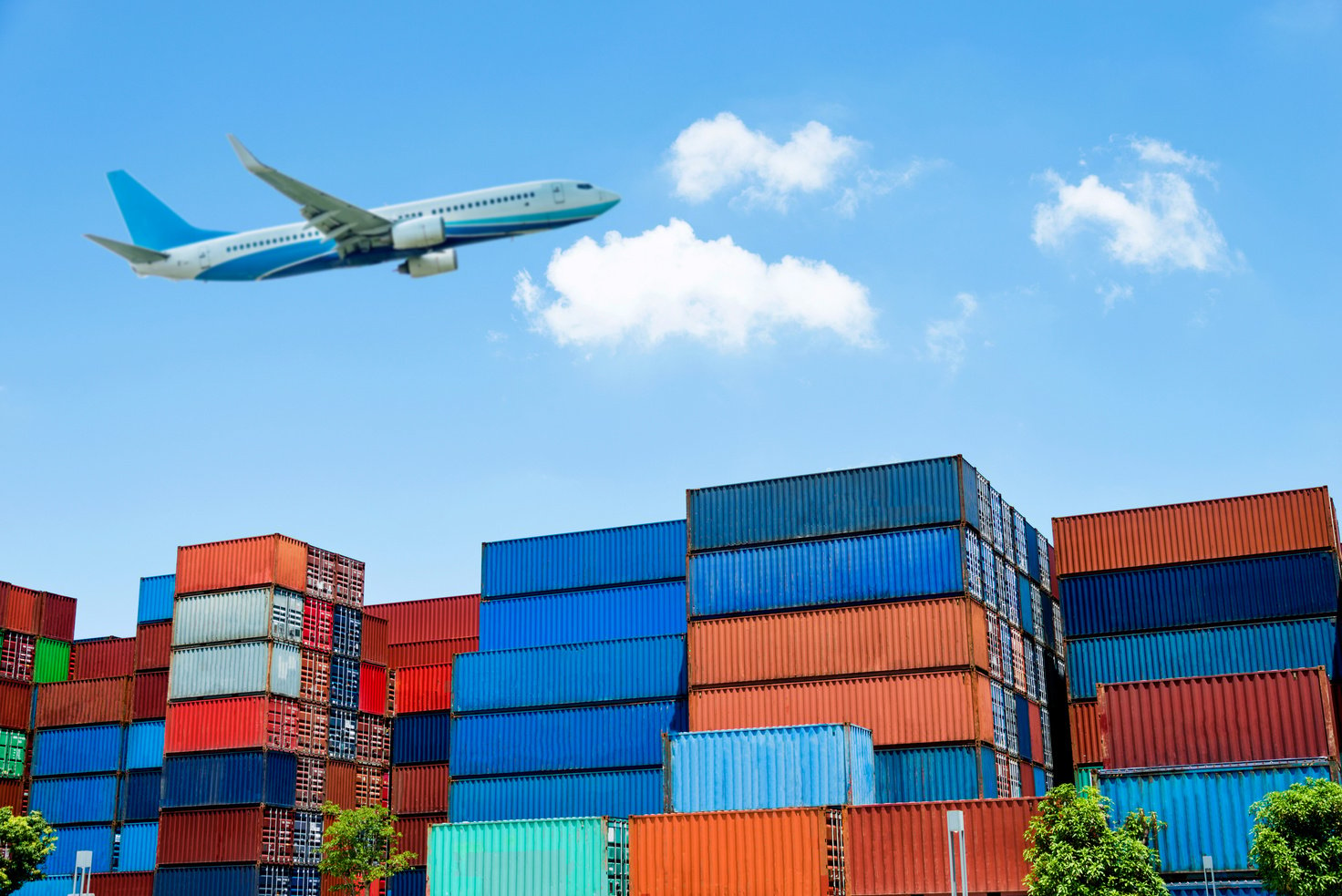 Air freight and stack of cargo containers at the docks